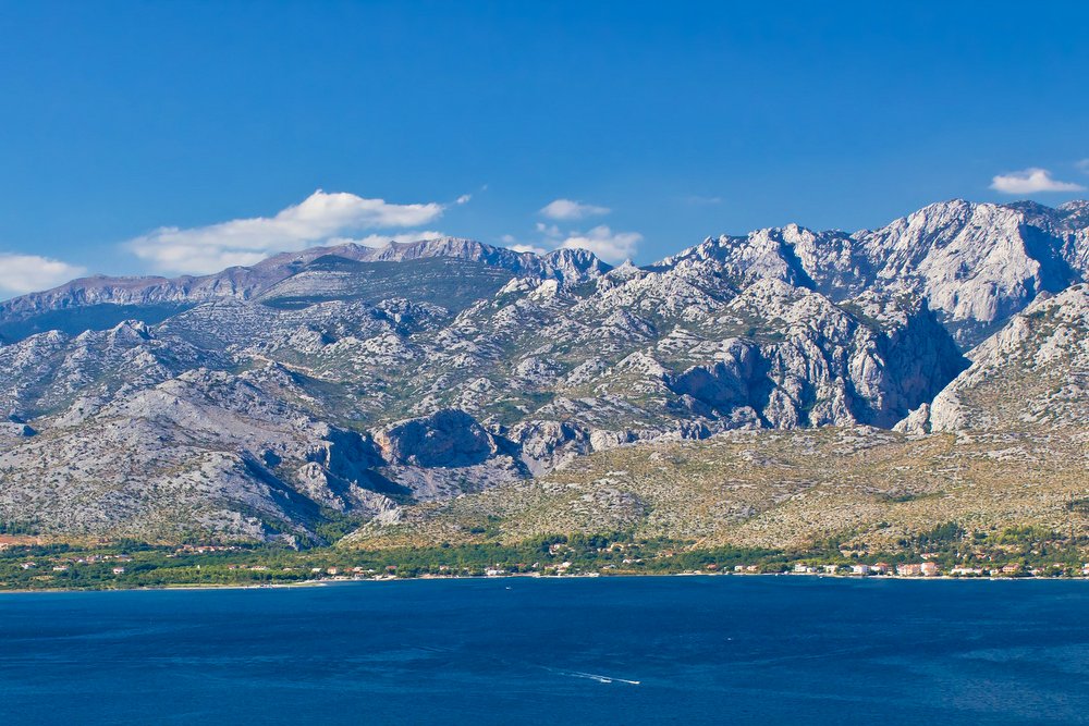 Green nature and blue sea, view of Town of Vinjerac and Paklenica national park on Velebit mountain